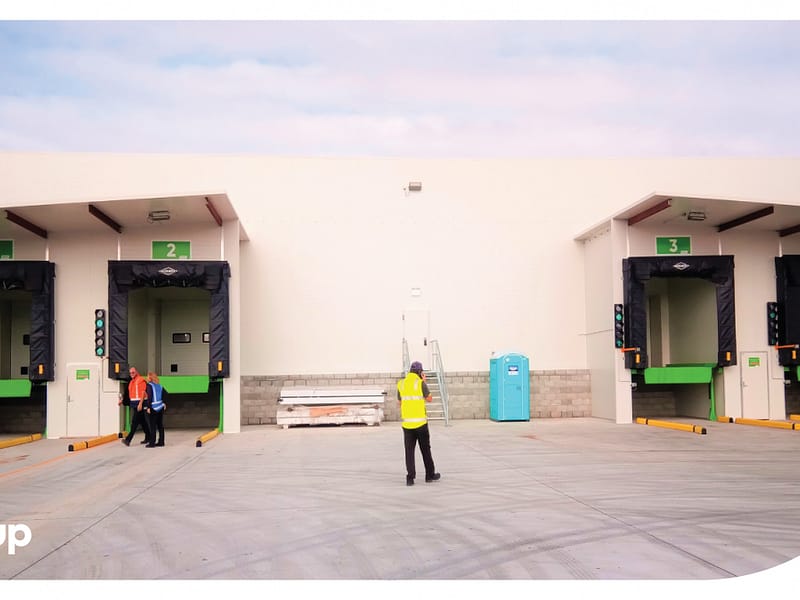 Four loading docks with dock seals and levellers at a facility.